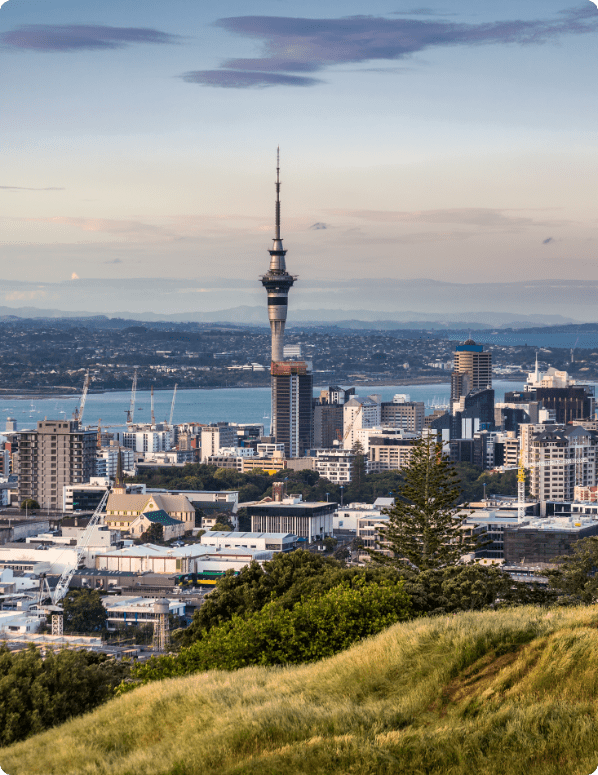 Auckland city view of skyline and Skytower as seen from top of Mt Eden at sunset